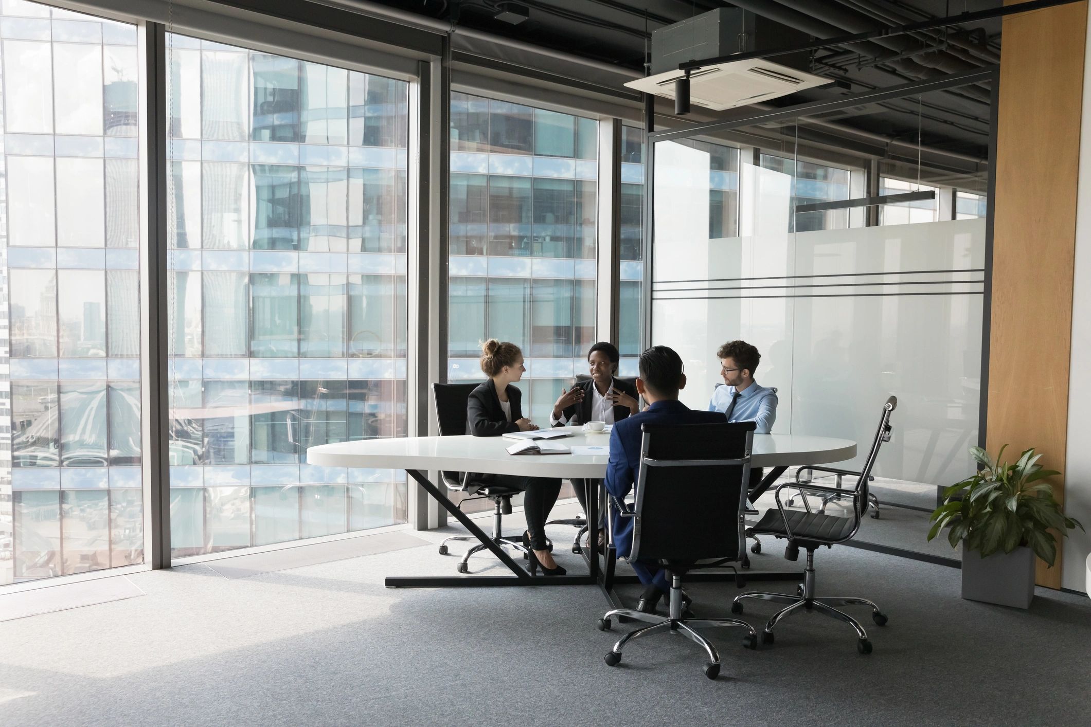 Professional logistics team meeting in a modern office