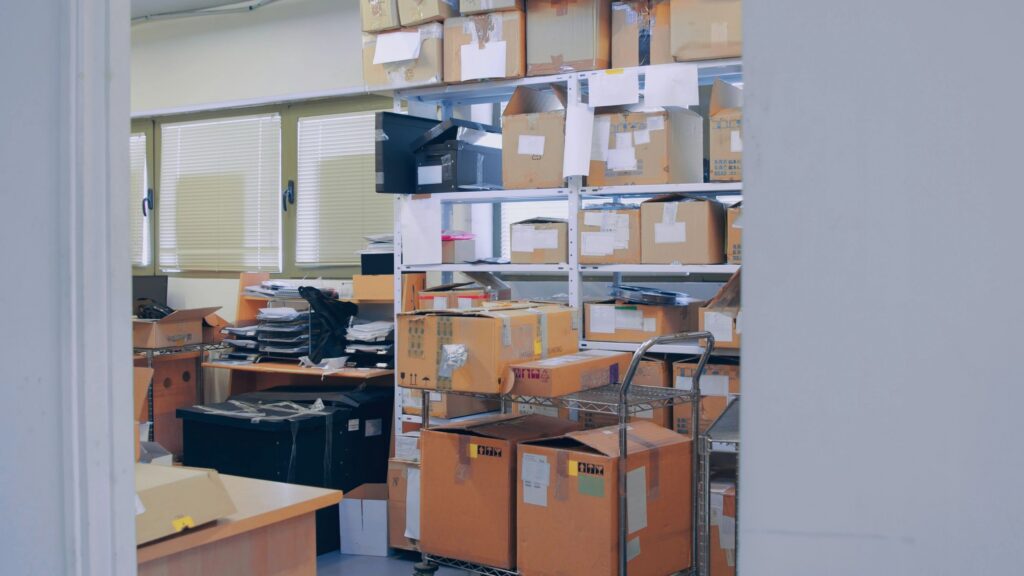 Shelves filled with boxes and equipment in a storage room
