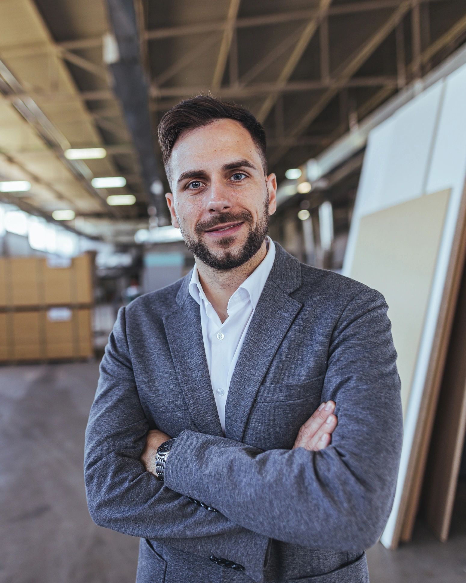 Professional team member portrait in industrial workspace