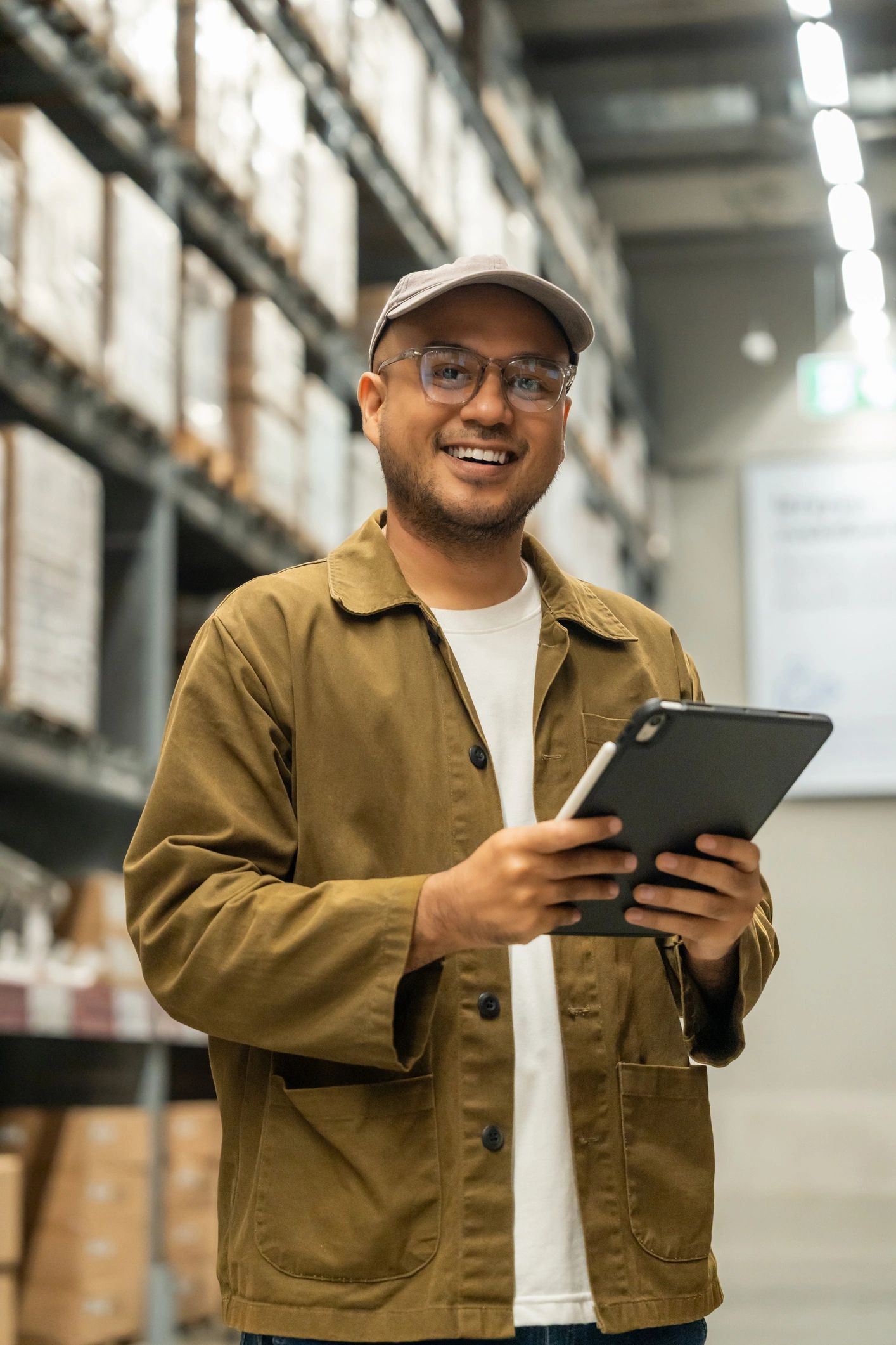 Logistics professional holding tablet in distribution center